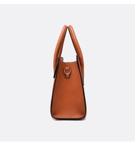 Side view of brown lychee pattern tote bag with gold D-ring and black edge paint details