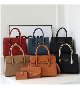 Detailed view of crocodile embossed leather bags set with gold square clasp and texture