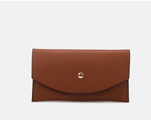 Detailed view of brown lychee texture leather wallet with elegant gold metal snap closure