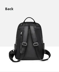 Detail view of the black lychee pattern backpack back with anti-theft zipper and straps
