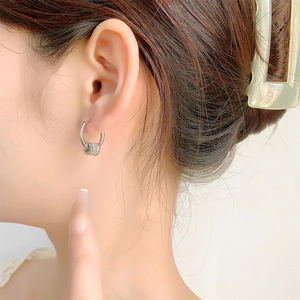 Elegant silver lucky bead hoop earrings with micro-pave white zircons on model