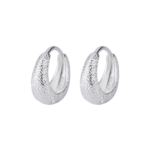 Macro shot of S925 sterling silver hoop earrings with textured hammered finish details