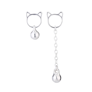 Detail of silver cat bell earrings featuring long tassel and asymmetrical chain drop design