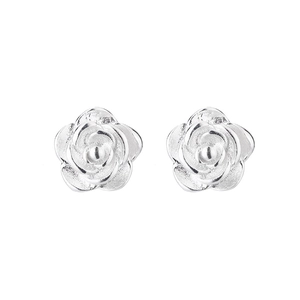 Macro detail of realistic silver rose stud earrings with textured petals on white background