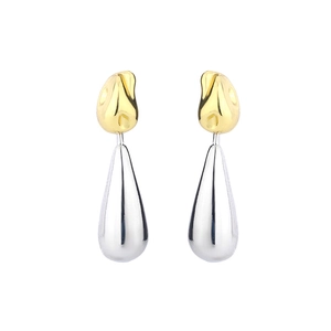 Detailed view of two-tone water drop earrings with polished gold and silver finish