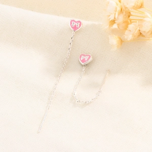 Macro shot of S925 sterling silver stamp on pink heart tassel drop earrings