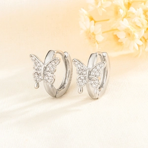 Detailed close-up of S925 sterling silver butterfly ear cuffs with sparkling zircons