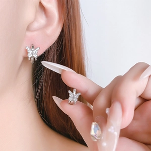 Detailed view of silver butterfly earrings with sparkling cubic zirconia micro-pave setting