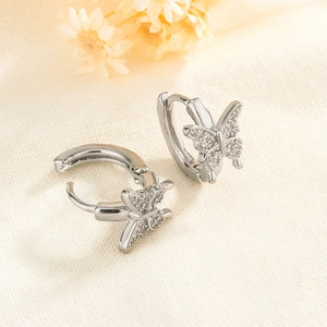 Detail view of silver butterfly hoop earrings with sparkling cubic zirconia pavé stones