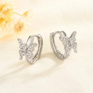 Detail shot of S925 sterling silver hoop earrings with sparkling zircon butterfly wings
