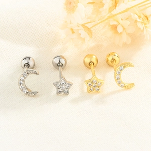 Macro detail of star and moon screw back stud earrings with micro-set zircon stones