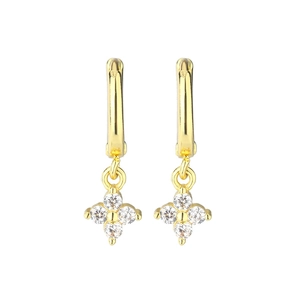 Detail of gold floral hoop earrings with sparkling cubic zirconia four-petal charms