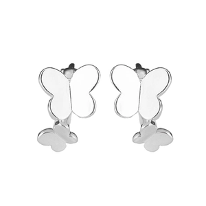 Detailed macro view of polished silver double butterfly earrings with glossy finish