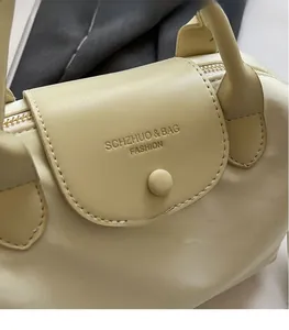Detail of oxford cloth handbag with leather flap and SCHZHUO & BAG FASHION logo