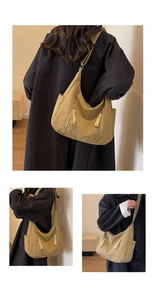 Detail view of large canvas messenger bag with functional zip pockets and adjustable strap