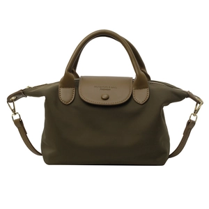 Army green nylon dumpling bag with brown leather handles and adjustable shoulder strap