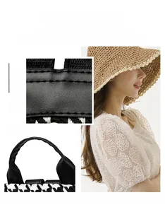 Detail of houndstooth woven fabric and high-quality black leather handle with stitching
