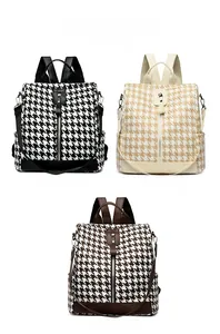 Three stylish houndstooth backpacks shown in black, white, and brown color options