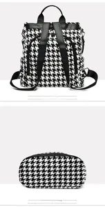 Detailed back and bottom view of houndstooth backpack with leather straps and pocket