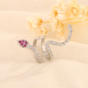 Detailed view of silver snake ring featuring micro-pave white and red zircon stones