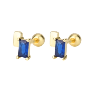 Detailed view of gold geometric stud earrings with rectangular blue zircon stones