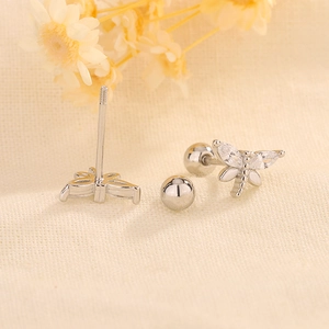 Detail of silver dragonfly stud earring with marquise zircon wings and screw back closure