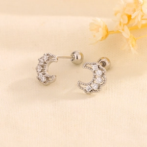 Detailed view of silver moon stud earring with clear zircon and screw back closure