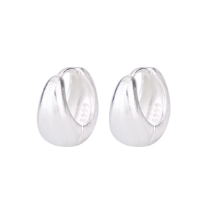 Close-up of S999 sterling silver U-shaped earrings with a brushed matte finish detail