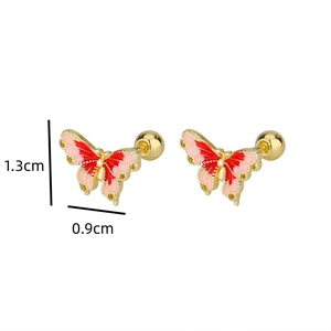 Macro view of butterfly stud earring with pink enamel and screw back ball closure