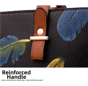 Detail of reinforced tote handle with precision stitching and metal rivets on leather