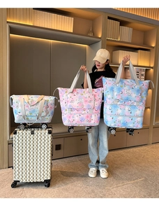 Three-piece travel tote set with rainbow print and 360-degree wheels in various sizes