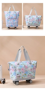 Detail showing foldable travel bag expansion feature with wheels and unicorn pattern