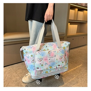 Detail of light blue unicorn travel bag with smooth wheels and quilted fabric texture
