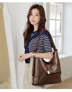 Detail of vintage dark brown tote bag showing large capacity and soft faux leather texture