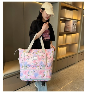 Quilted unicorn travel bag with wheels shown in-use by a model in a minimal setting