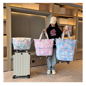 Expandable rolling travel tote with wheels in blue and purple gradient star pattern