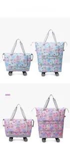 Dual-layer expandable travel bag with wheels in mint green and cherry blossom pink colors
