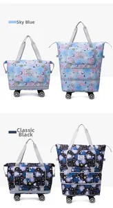 Detail showing foldable travel bag with cartoon prints and expandable wheels in two colors