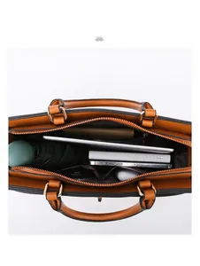 Macro view of large tote bag interior showing capacity for iPad and daily essentials