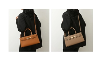 Detail of adjustable shoulder straps and metal clasp on leather tote bag set