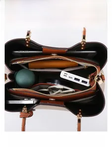 Top view of large capacity tote bag interior with multi-compartment storage for iPad and umbrella