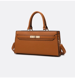 Detail of brown pebbled leather handbag with gold twist lock and black edge finish