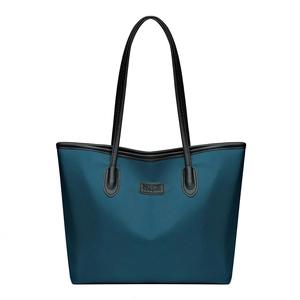 Large capacity dark peacock blue tote bag with black leather straps and brand label