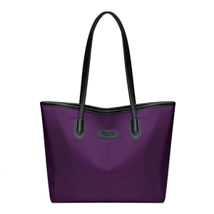 Large purple nylon tote bag with black leather handles and NICE FASHION brand patch