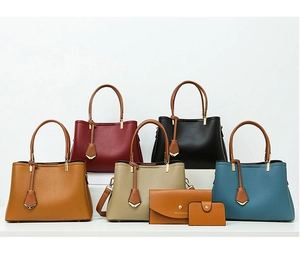 Detailed view of multi-piece tote bag set with matching clutches in various colors