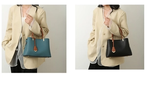 Close-up of minimalist large tote bag in black and teal with brown straps and metal charms
