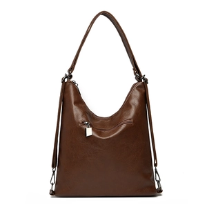 Large dark brown vintage leather hobo shoulder bag with zipper pocket on white background