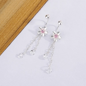 Detailed close-up of silver sakura earrings with pink zircon and elegant long chains