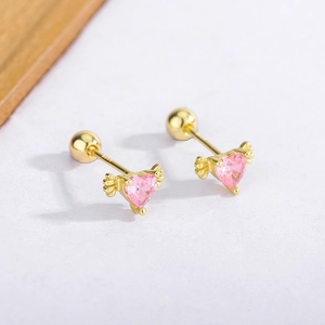 Detailed macro view of S925 sterling silver gold-plated heart wing stud earring