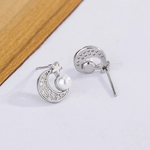 Elegant S925 silver stud earrings featuring star, moon and white pearl accents